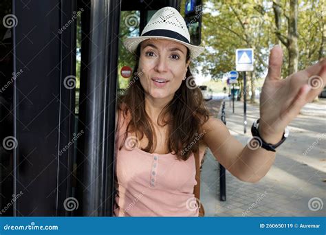 woman at bus stop making gesture acknowledgement stock image image of