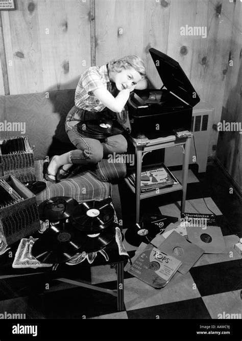 1950s Teen Girl Listening To Music On Phonograph Sit On