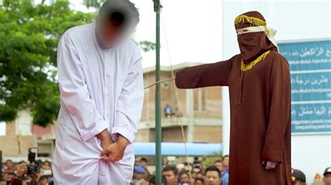 crowds cheered as gay men were caned dozens of times in indonesia vice