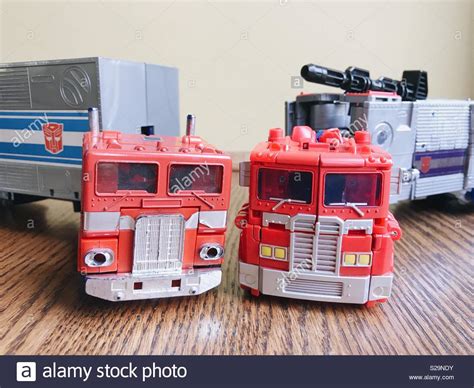 comparison between transformers toys old and new original vintage optimus prime left and new