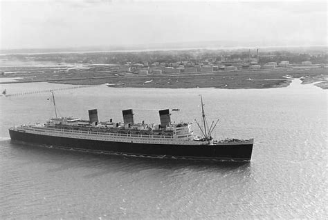 ss queen mary  liner ss queen mary passing fawley oil refinery     southampton