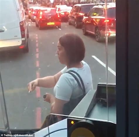 shocking moment a furious woman blocks a bus in the middle of the road