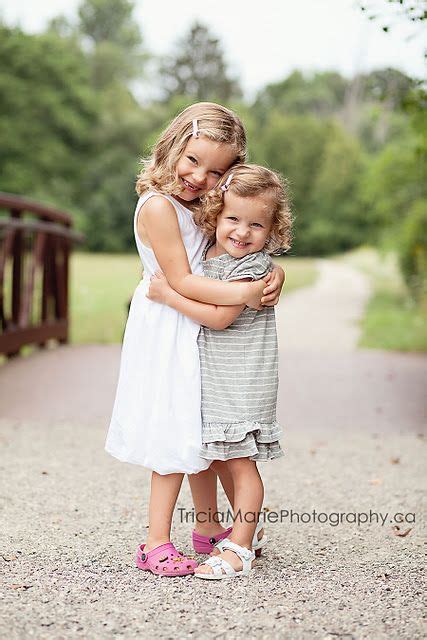 cutest girls ever sibling photography poses sisters photoshoot