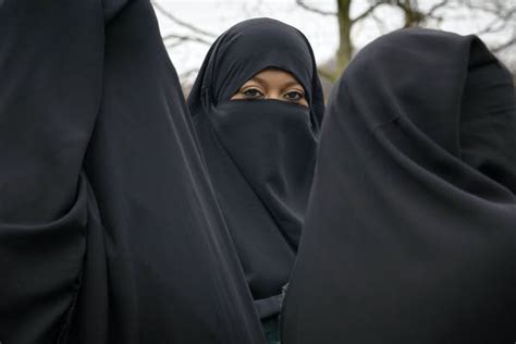muslim women excited   wearing face coverings