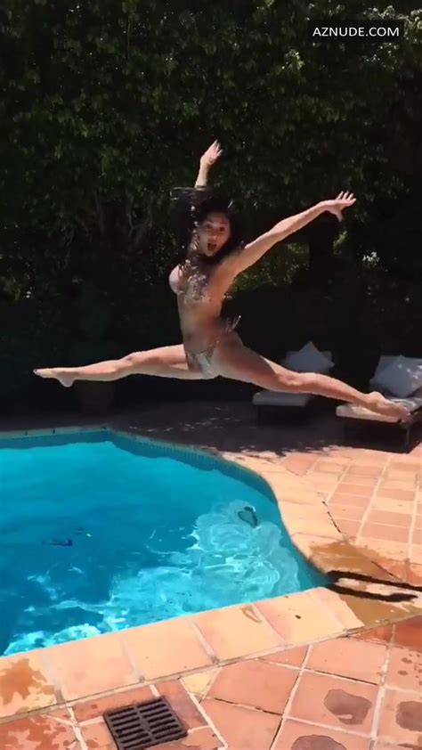 nicole scherzinger poses by the pool and shows off her