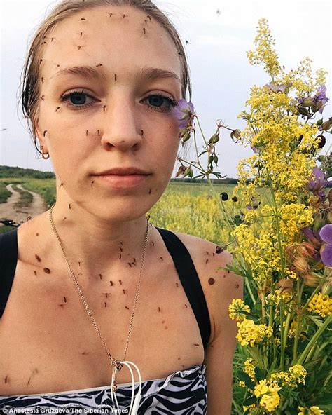woman behind frozen eyelashes selfie shows face covered in mosquitoes daily mail online
