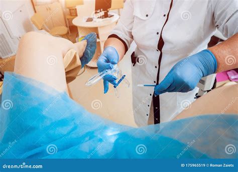 woman in gynecological chair during gynecological check up with her