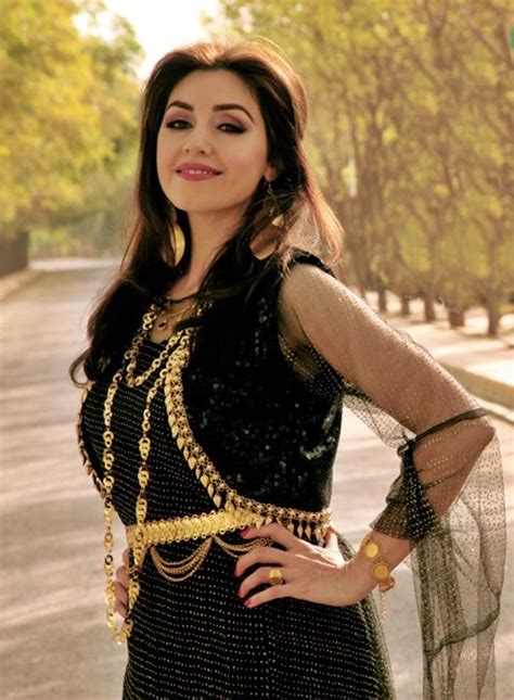 nadia kurdish singer in a kurdish black dress with golden