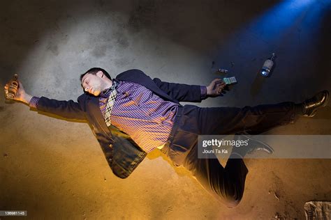passed out man lies on ground stock foto getty images