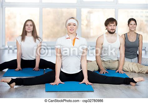 seated straddle pose fitness stretching practice group of four