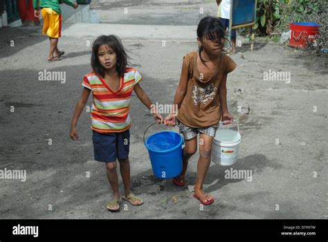 Girls Carrying Water Taal Volcano Luzon Philippines Asia Stock