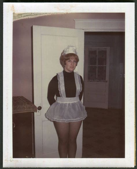 vintage color polaroid photo of woman dressed as french maid 1960 s