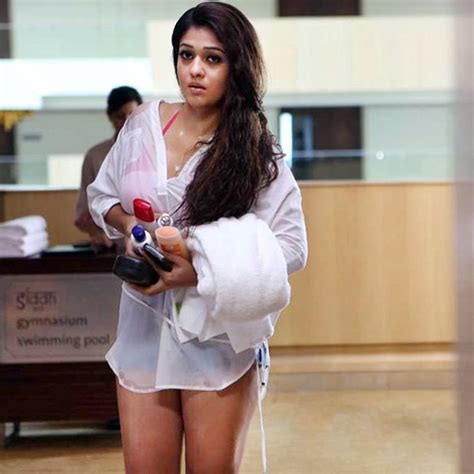 nayanthara looks sizzling hot in this wet white shirt