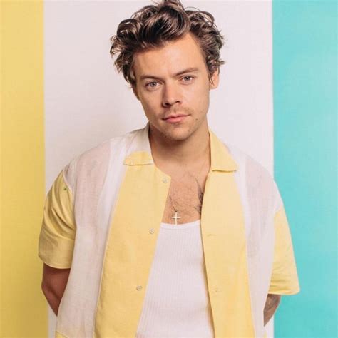 the short sleeved shirt white and yellow worn by harry styles on the