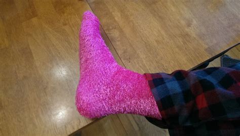 as a 20 year old male should i be ashamed of wearing my gfs pink fuzzy socks or should i