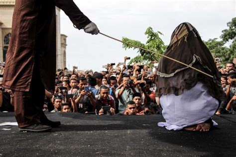 indonesian woman caned after adultery conviction in aceh