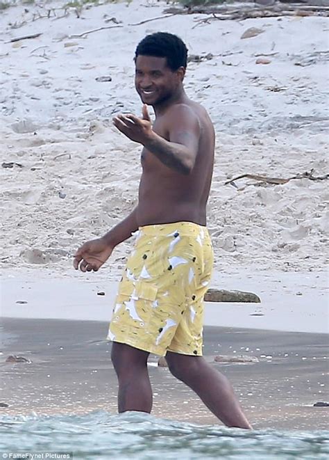usher hits the beach on holiday with wife daily mail online