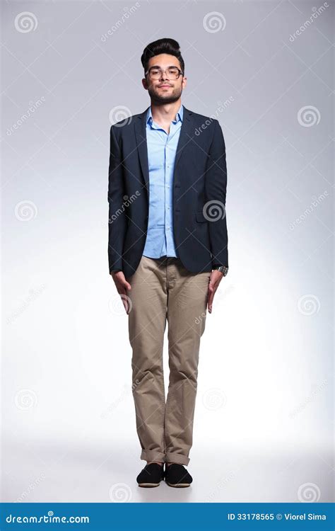 casual young man standing straight stock image image  posing