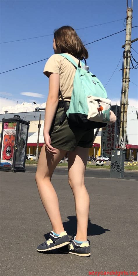 cute dorky girl in shorts with thin muscular legs street