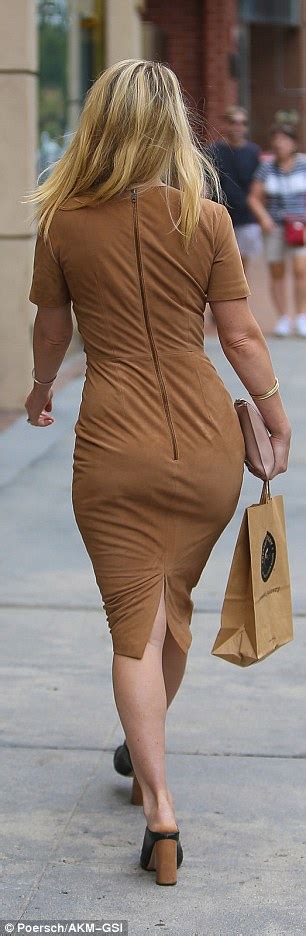 Alice Eve Shows Off Curves In Figure Hugging Camel Coloured Dress In