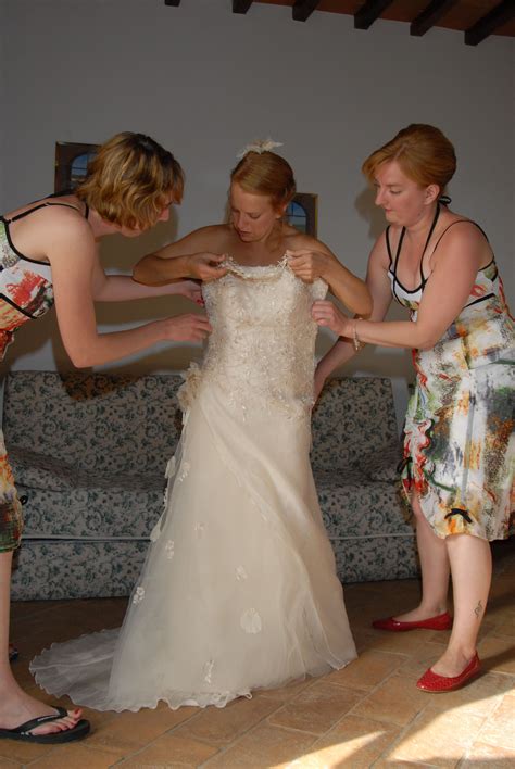 Bridesmaids Helping Bride In Her Weddingdress Wedding Dresses Lace