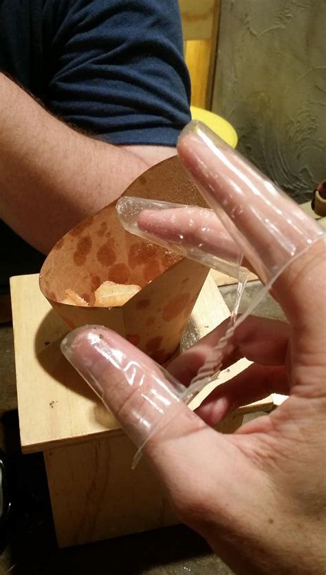 weird plastic finger covers for eating chips in korea