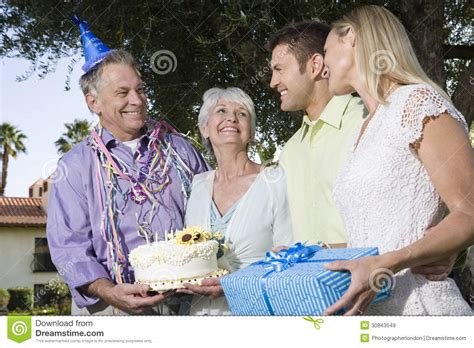 two couples during a birthday party in garden royalty free stock images