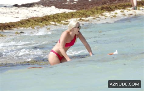 lindsey vonn sexy seen in a red bikini as she takes paddle board for a