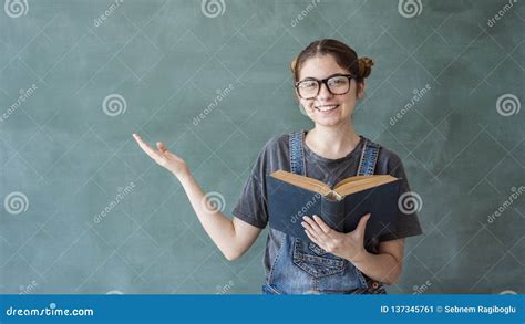 smiling student girl showing  stock image image  girl selling