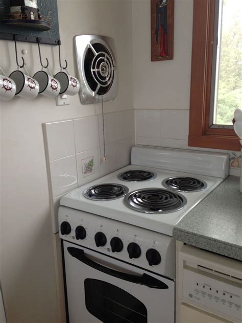 cottage kitchen  vintage nutone fan  operational pull chain kitchen exhaust