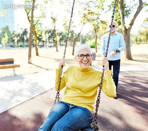 Woman Man Outdoor Senior Couple Happy Swing Swinging Fun Leisure