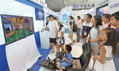 visitors at the china national nuclear corp stand at an