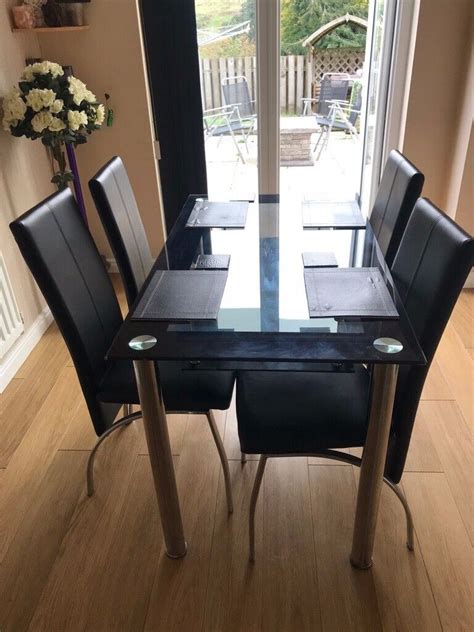 seater black glass dining table  chairs  aberdeenshire gumtree