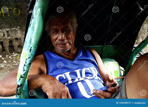 A Mature Filipino Man Sits Inside A Tricycle Cab Editorial Photography