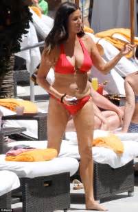 Patti Stanger Pours Out Of Crimson Bikini As She Steps Into Miami Surf
