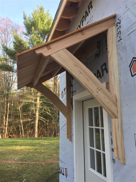 awning barn mortiseandtenon cedar house exterior house design porch roof