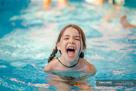 girl  swimming pool head  shoulders person stock photo