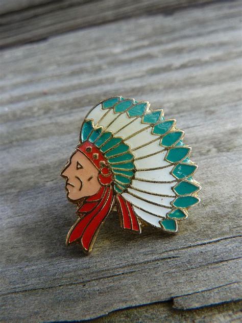 native american enamel pin featuring indian in feather