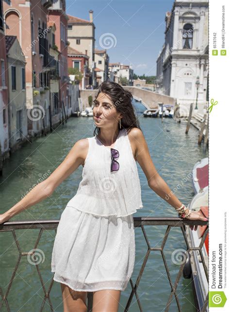 beautiful fashion woman with white dress in venice italy