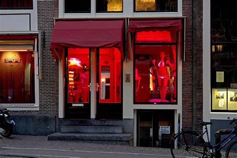 Netherlands Amsterdam Red Light District At Night Prostitute At The
