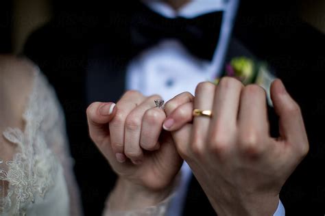 Wedding Couple Holding Hands Showing Off Rings Stocksy United