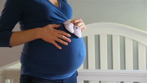 closeup of pregnant mother rubbing her belly stock footage video 3786620 shutterstock