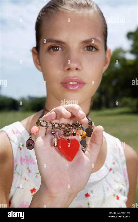 teenage girl holding  necklace stock photo alamy