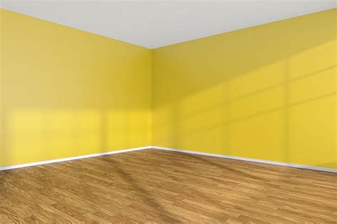 empty room corner  yellow walls  wooden parquet floor stock