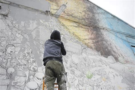 street artist blu destroys  years   work  bologna  protest