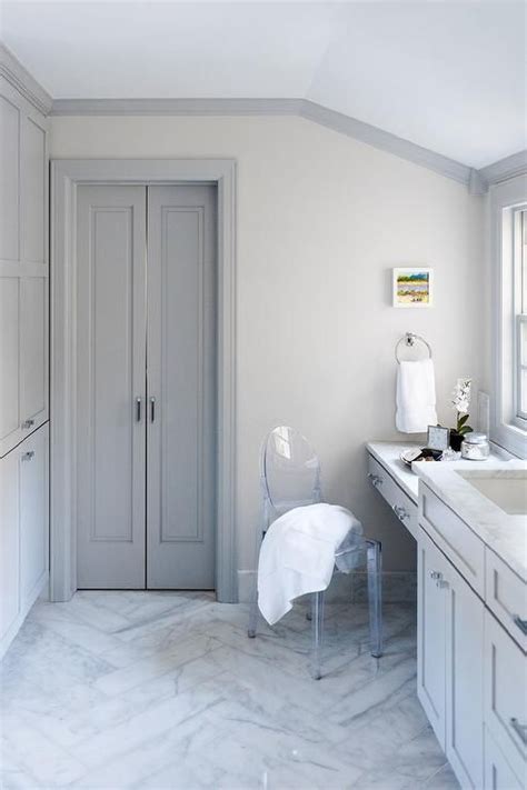 Gray bifold master bathroom doors compliment gray crown