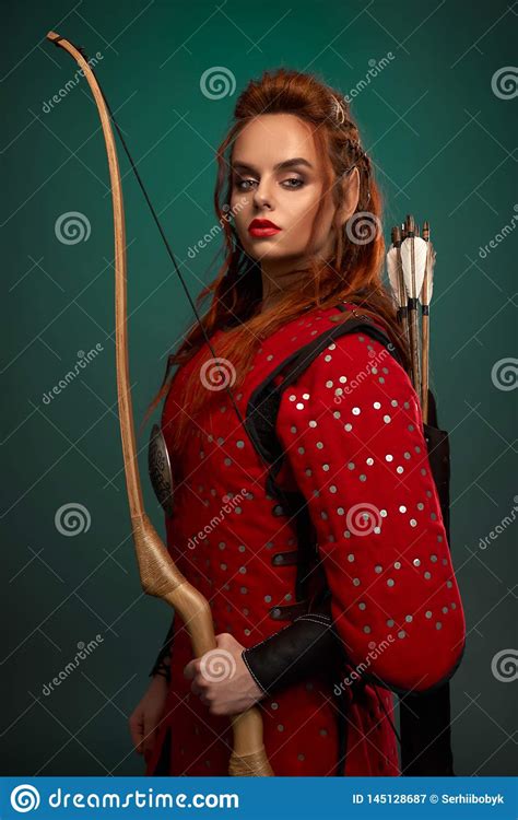 Female Warrior Posing With Bow And Arrows Stock Image