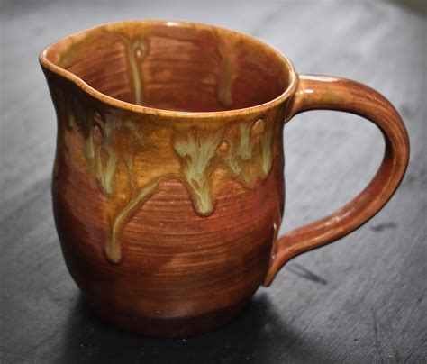 small handmade pottery pitcher  village  artisans