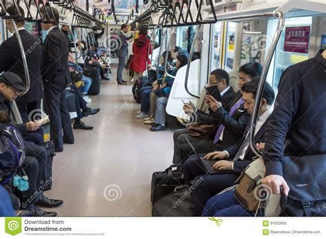 passengers inside a japanese train editorial photo image of laptop