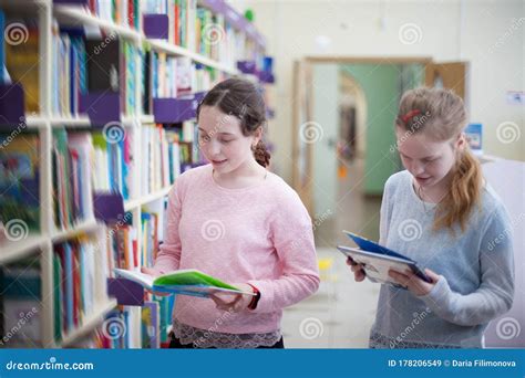 Girls Choosing Book In Library Stock Image Image Of Reading Learning